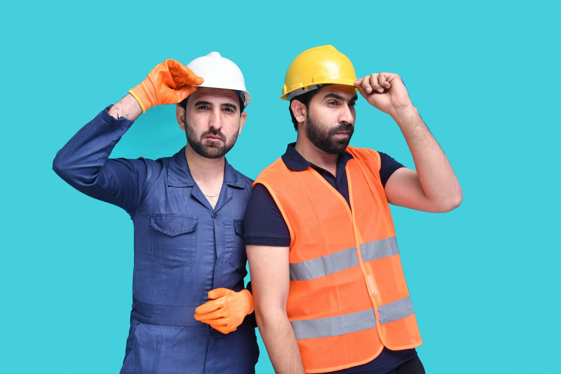 a few men wearing hard hats